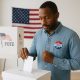 Christian man casting his vote at an American polling station