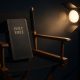 Christian Films - A Holy Bible resting in a director's chair under a spotlight, symbolizing truth in mainstream filmmaking