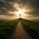 A narrow path leading to a cross on a hill symbolizing that Jesus is the only way to salvation.