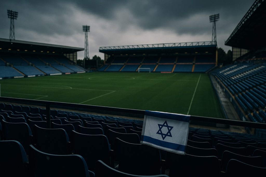 Jewish Discrimination in the UK shown by empty football stadium with Israeli flag draped over seat railing