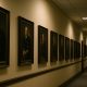 Government hallway with framed portraits symbolizing biblical truth and cultural conflict