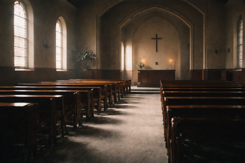Quiet, empty church interior reflecting God’s silence