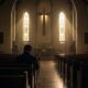 Man sitting alone in a church sanctuary reflecting on lifelong celibacy and Christian discipleship